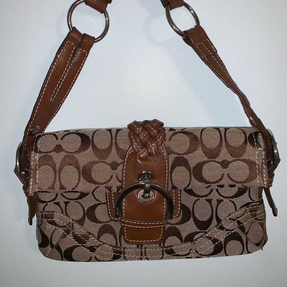 I am selling an adorable brown/ tan coach purse!